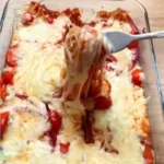 baked spaghetti with cherry tomatoes and cheese